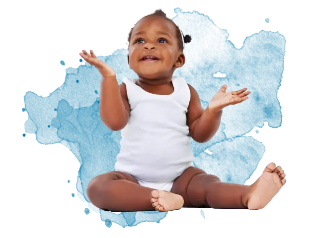 Smiling baby in white onesie sitting with arms raised on blue graphic background