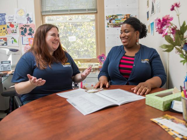 two advisors talking in an office