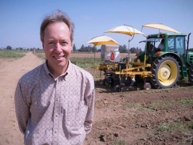 Man and tractor at UC Davis. 