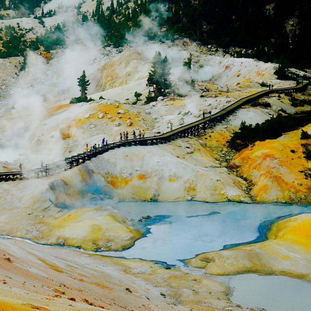 A crowd walking through a geothermal area in Lassen Volcanic National Park