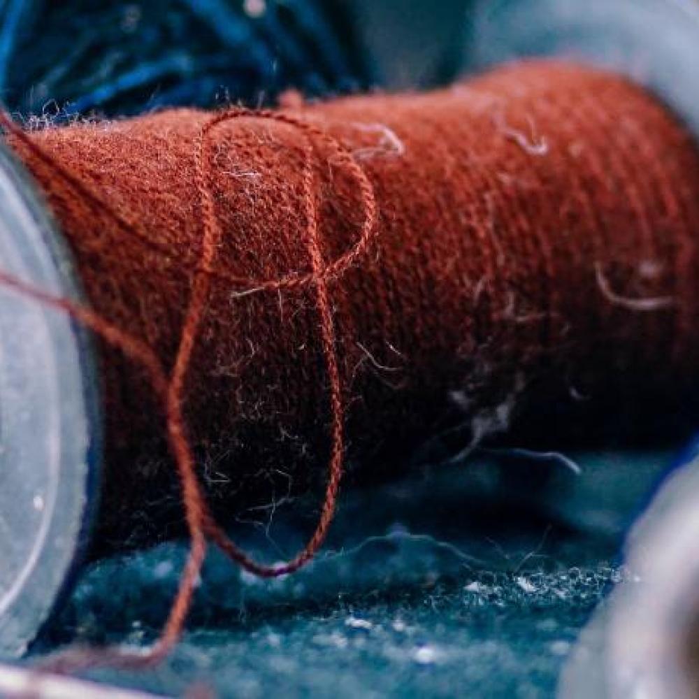 zoomed in image of spools of yarn
