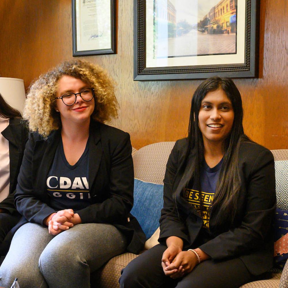 a group of female students having a discussion