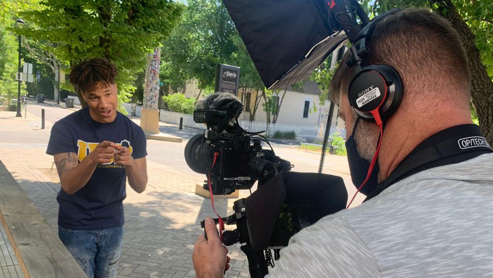 A male student talks as he's being filmed