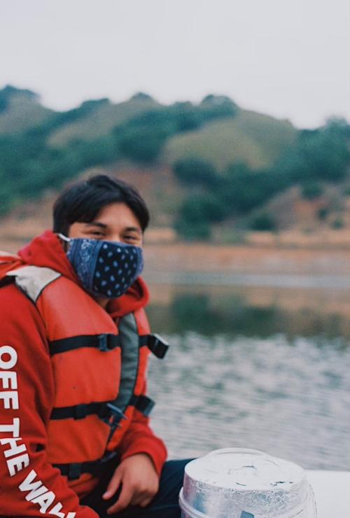 Sergio Jimenez in a boat with a mask and life jacket on