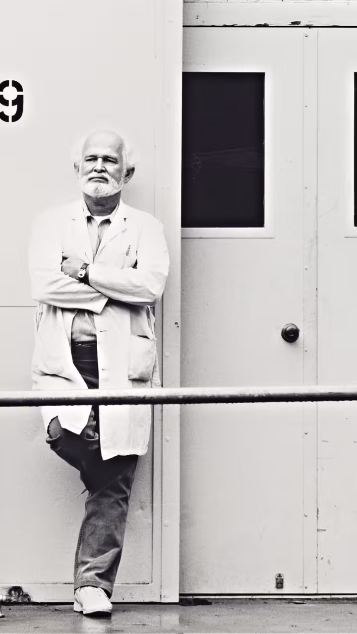 professor standing next to TB9 wall