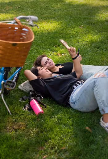 students share a video on the grass