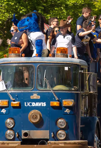 Student ride on a custom made "UC Davis" fire engine in the annual Picnic Day parade 