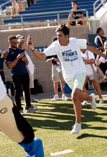 First year students charging the football field