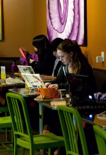 Students study while grabbing a bite to eat
