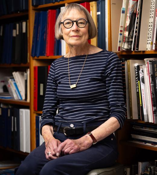 Shannonhouse, portrait, woman in front of books