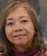 Portrait of a smiling older woman with shoulder-length light brown hair