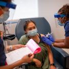 Woman receives vaccination.