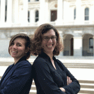 Two Planetary Health fellows pose in front of the State Capitol.