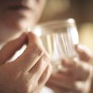 closeup of a person taking a pill