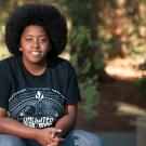 Chake'ra "Star" Bacon, community and regional development major at UC Davis, in the UC Davis Arboretum