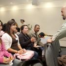 Sam Blanco talks with a family at Decision UC Davis