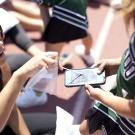 Woman swabbing cell phone