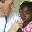 Paul Farmer and an unidentified patient in Haiti in 2001.