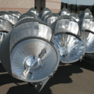 Photo shows part of one of the banks of lights, prior to
being hoisted into place. A Musco Lighting spokesman said the reflectors
within each fixture are customized for that light, ensuring that the beam
goes &ldquo;where we want it go.&rdquo; The re