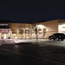 Outside of hospital at night showing the lighting for parking