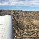 Aerial view of Southern California hills with sky in background