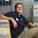 Andrew Musca in piles of textbooks