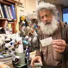 Art Shapiro holds an envelope containing a butterfly.