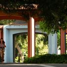 A female student on bike rides near Wright Hall