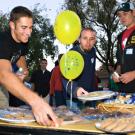 Photo: Block party scene (people at food table)