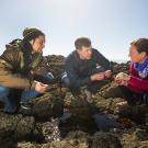 A professor and students outside at UC Davis' Bodega Marine Lab 