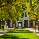 students walking on campus in front of Mrak Hall - latest coronavirus information from Undergraduate Admissions