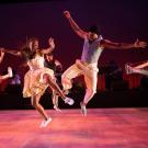 Dorrance dancers jumping on stage.