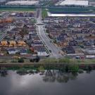 Homes behind a levee in Stockton, California.