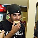 Photo: Marie Lee, Scot Heylman and Tj Copple eat a cookie.
