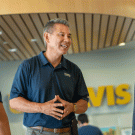 Police Chief Joe Farrow, in civilian clothes, chats with two students.