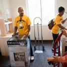 Gary May helping to move a mini-fridge.