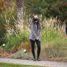 Three women, in masks, pose in Arboretum.