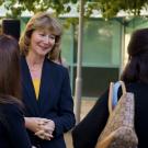 Jennifer Sinclair Curtis speaks to two women.