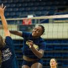 Kelechi Ohiri at the net during a volleyball practice