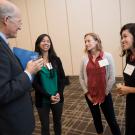 Ken Burtis talks with Marie Cuevas Heffern, Kara Rudolph and Miriam A. Nu&ntilde;o.