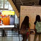 Students look at a white board asking about their space needs in the library