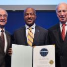 Chancellor May, holding certificate of membership in the National Academy of Engineering