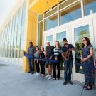 ASUCD President Josh Dalavai cuts a ceremonial ribbon at the Memorial Union.