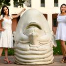 Two women pose for photo near Egghead.