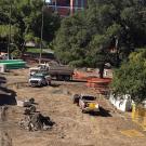 Photo: Tractors and dump trucks at construction site