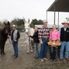 A ceremonial saddle is presented to members of the UC Davis packing team.