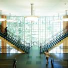 Double staircase against wall of windows in Shields Library