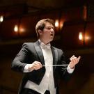 Photo: Student conductor Garrett Rigsby wields baton.