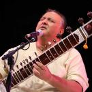 Shujaat Khan, singing, playing sitar.