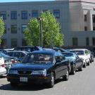 Cars parked in "stack parking" arrangement.